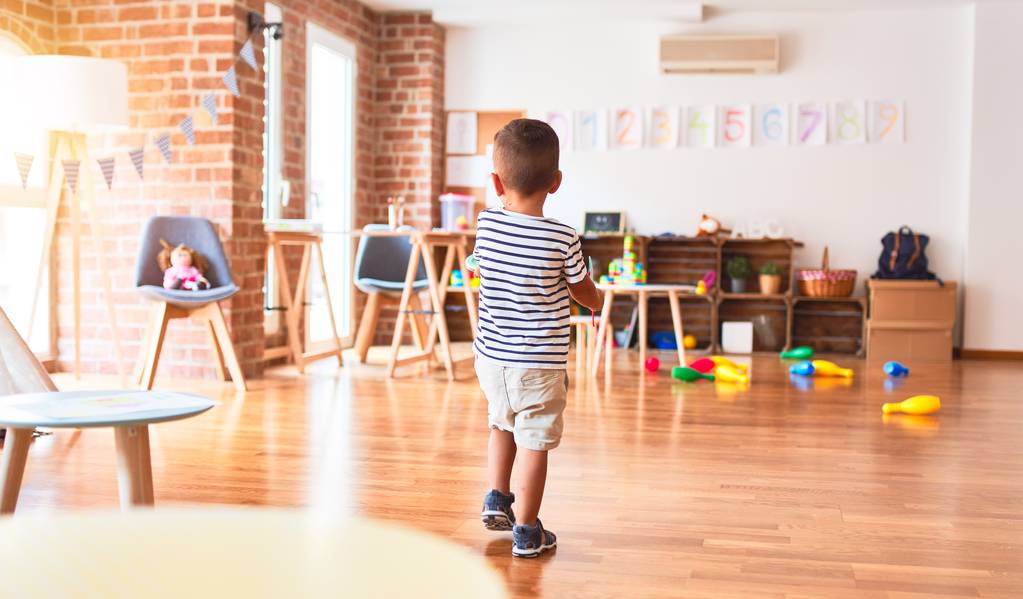 toddler boy standing at kindergarten